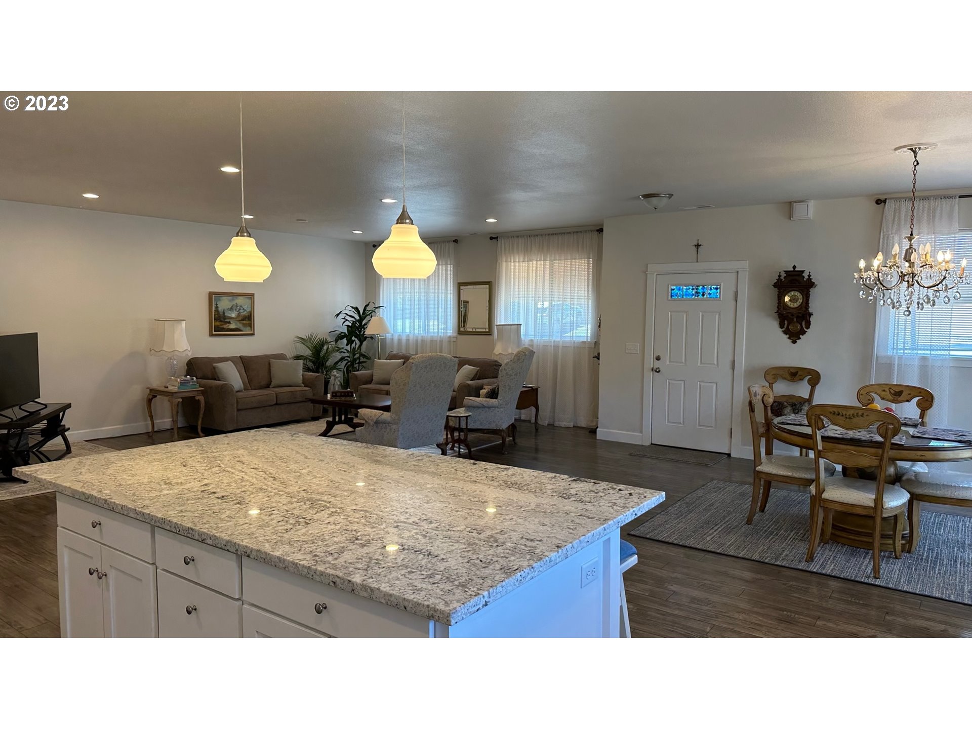 746 Divot Loop Sutherlin, OR 97479 - Photo 26 of 32 a kitchen with kitchen island a counter top space a sink a center island and furniture