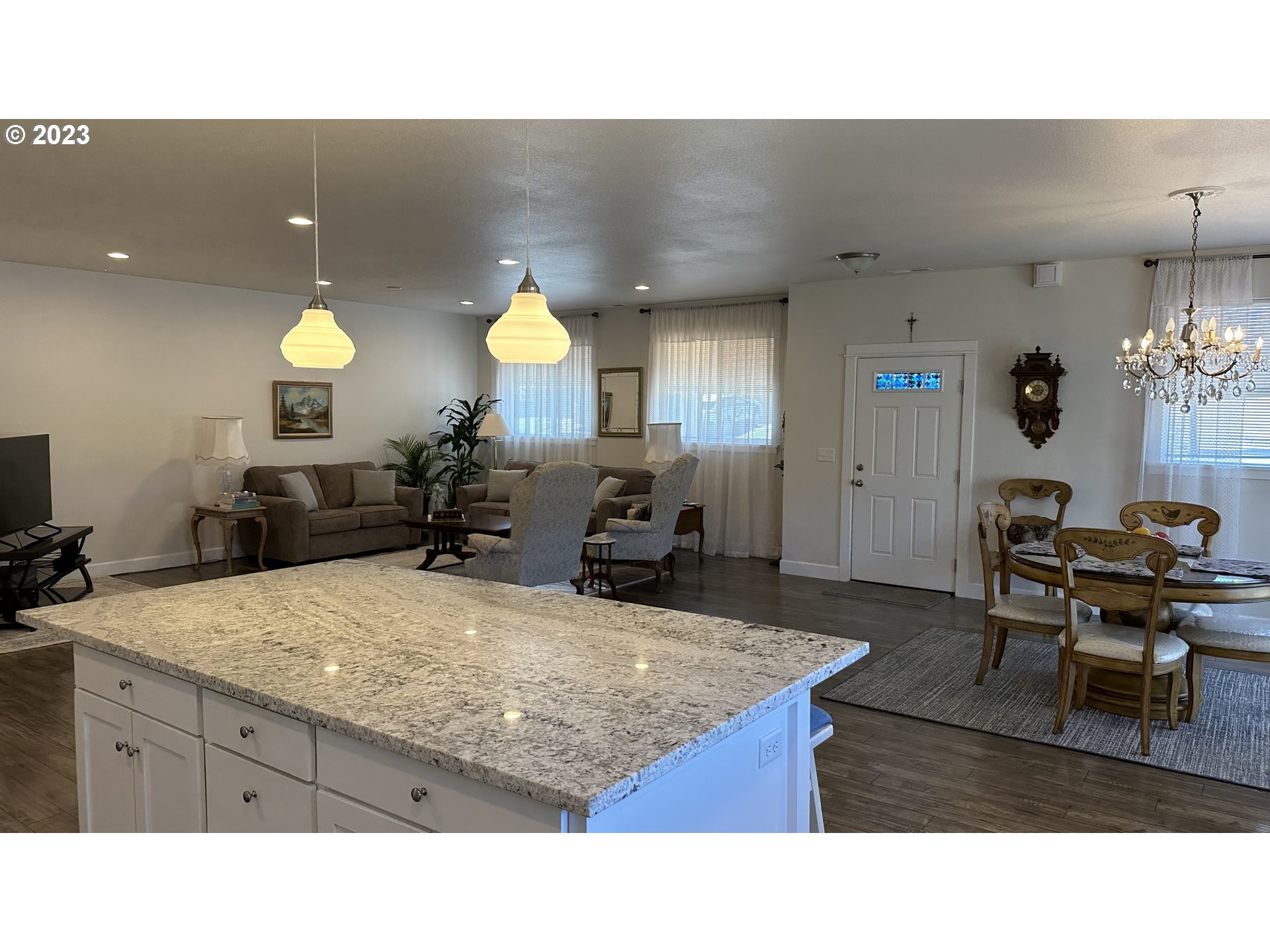 746 Divot Loop Sutherlin, OR 97479 - Photo 28 of 32 a kitchen with kitchen island a counter top space a sink a center island and furniture