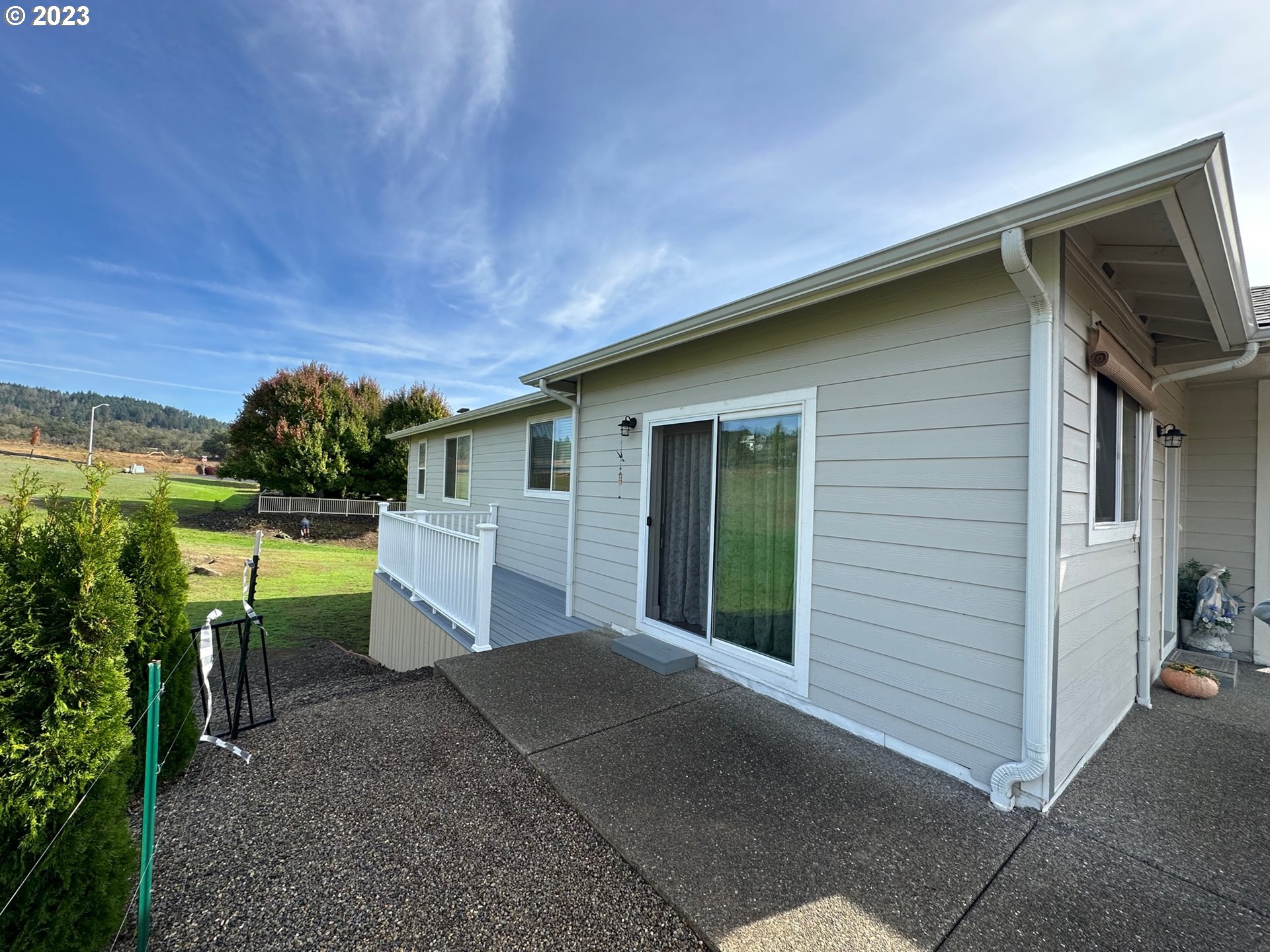 746 Divot Loop Sutherlin, OR 97479 - Photo 30 of 32 a view of a house with backyard and garden