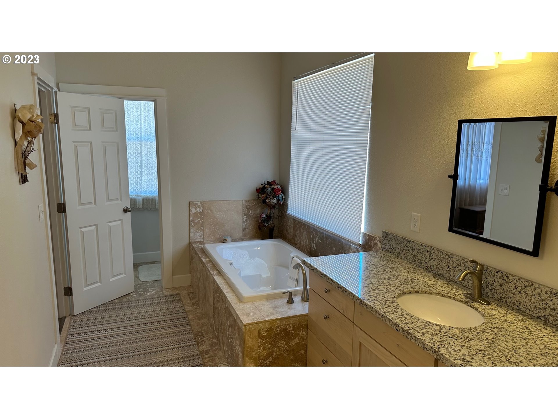 746 Divot Loop Sutherlin, OR 97479 - Photo 7 of 32 a bathroom with a sink and a mirror