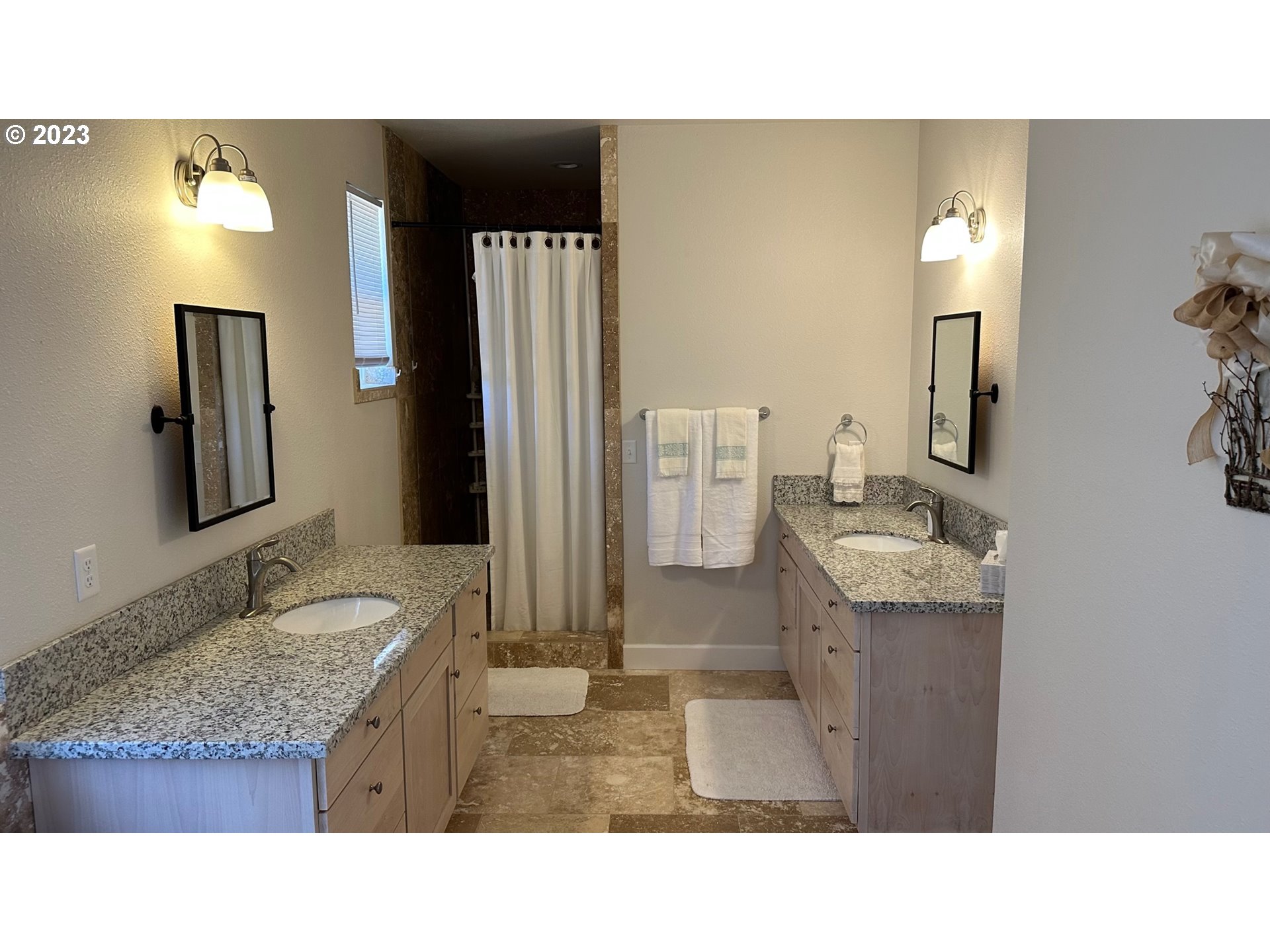 746 Divot Loop Sutherlin, OR 97479 - Photo 8 of 32 a bathroom with a sink double vanity granite and a mirror