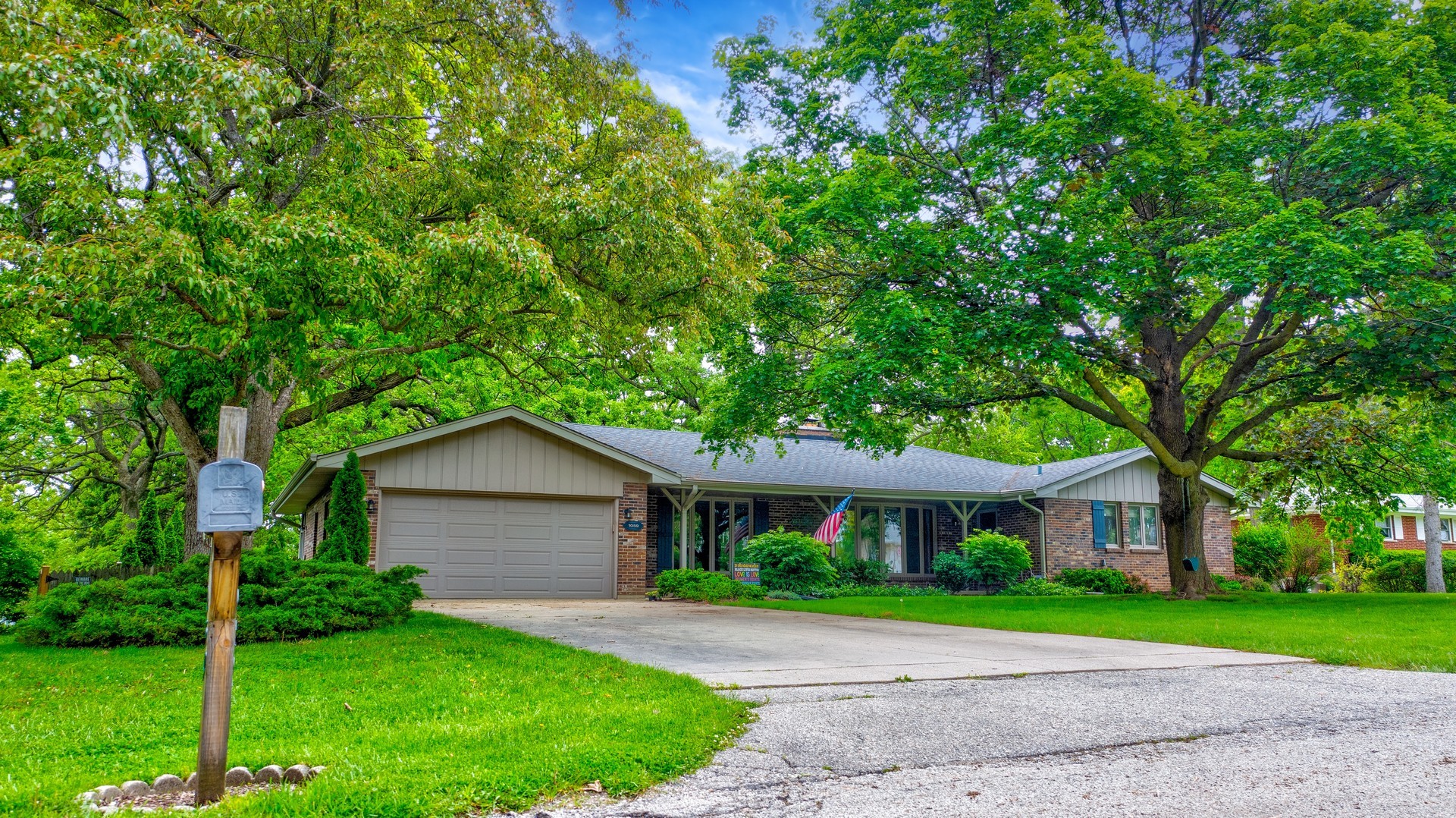1059 Branch Road Gurnee, IL 60031 - Photo 2 of 28 a house that has a tree in front of it