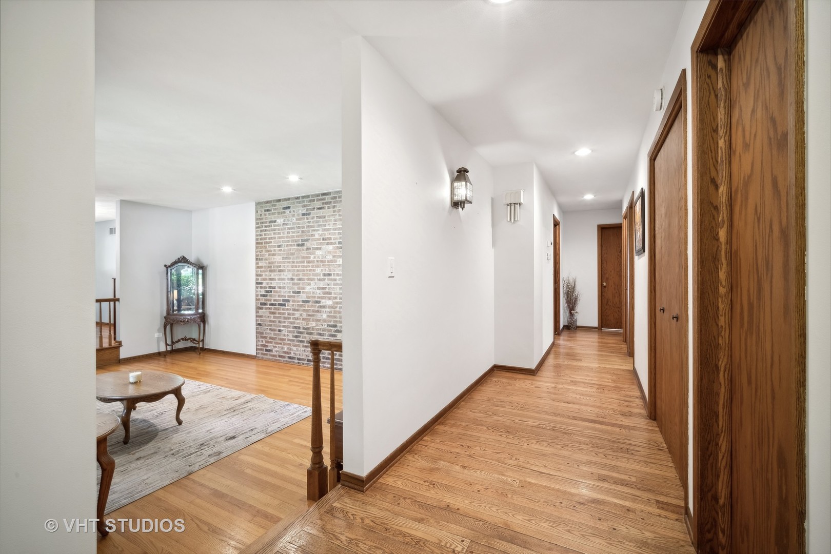 1059 Branch Road Gurnee, IL 60031 - Photo 6 of 28 a view of a hallway with wooden floor and furniture