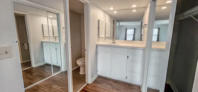 a spacious bathroom with a glass door shower