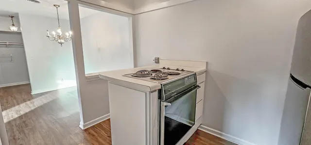 a view of kitchen island with wooden floor