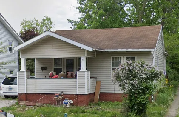 a view of house with yard
