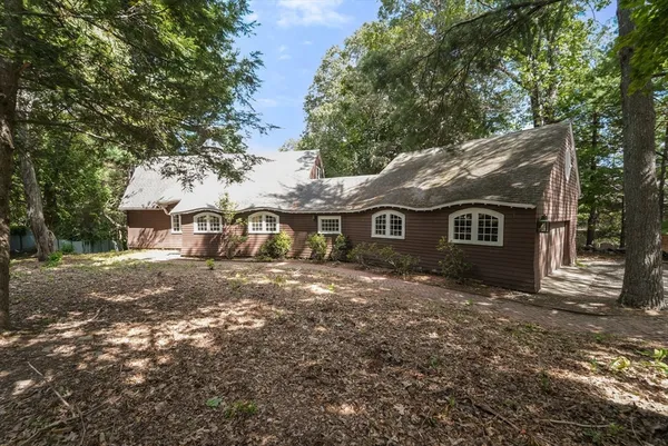 a front view of a house with yard