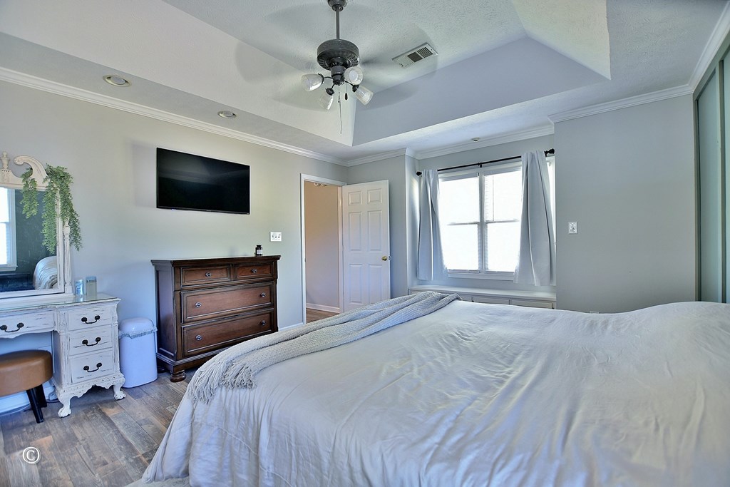 129 Hunter Road Cataula, GA 31804 - Photo 20 of 28 a bedroom with a bed and a flat screen tv