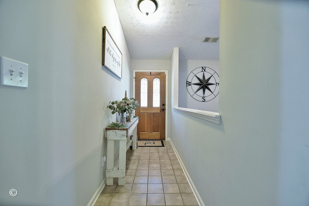 129 Hunter Road Cataula, GA 31804 - Photo 23 of 28 a view of a hallway and wooden floor