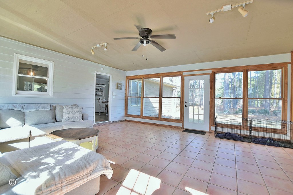 129 Hunter Road Cataula, GA 31804 - Photo 28 of 28 a spacious bedroom with a large bed and a large window