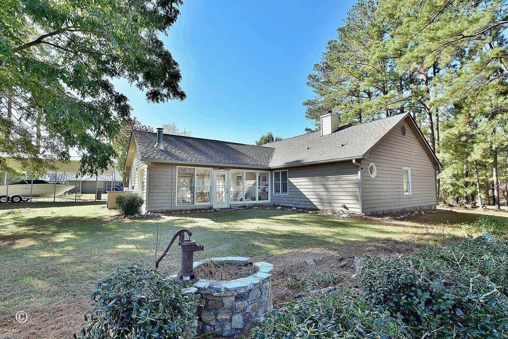 129 Hunter Road Cataula, GA 31804 - Photo 9 of 28 a house view with a sitting space and garden