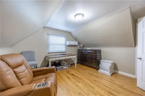 a room with furniture and a wooden floor