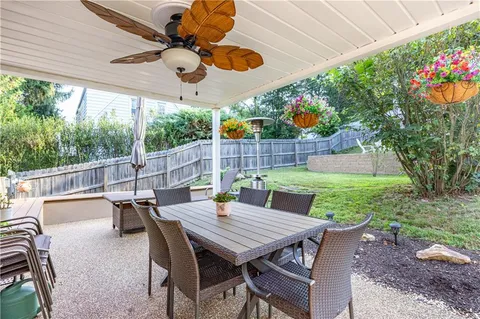 a view of a backyard with a wooden fence