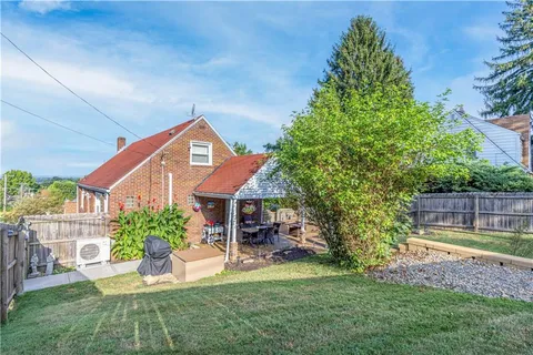 a backyard of a house with lots of green space