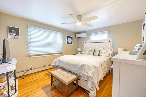 a bedroom with bed and a window