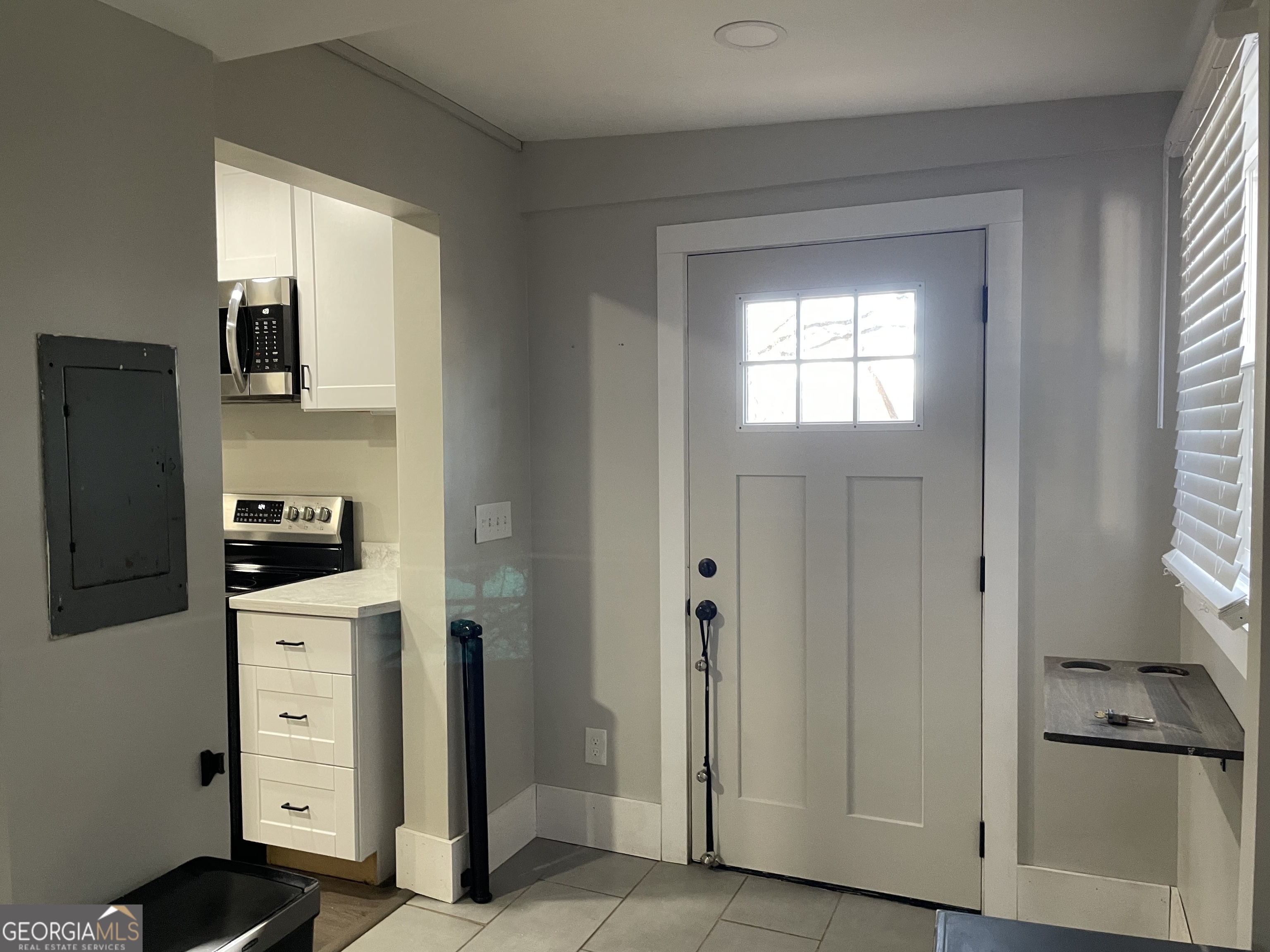 5186 Wheat Street Northeast Covington, GA 30014 - Photo 10 of 10 a kitchen with a refrigerator stove and cabinets