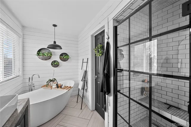 a bathroom with a double vanity sink and a bathtub