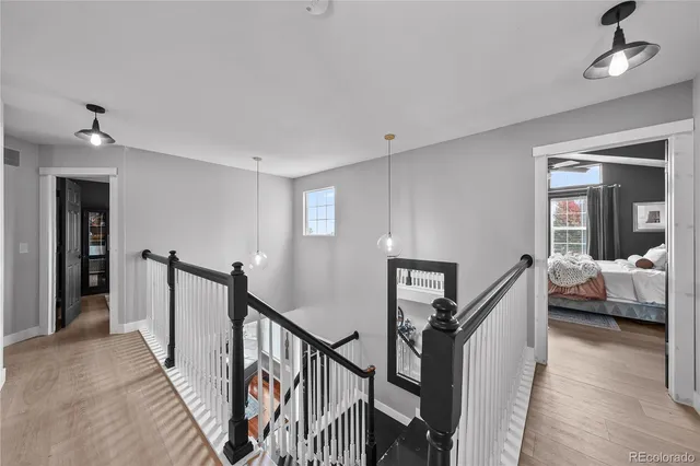 a bedroom with a bed and a potted plant