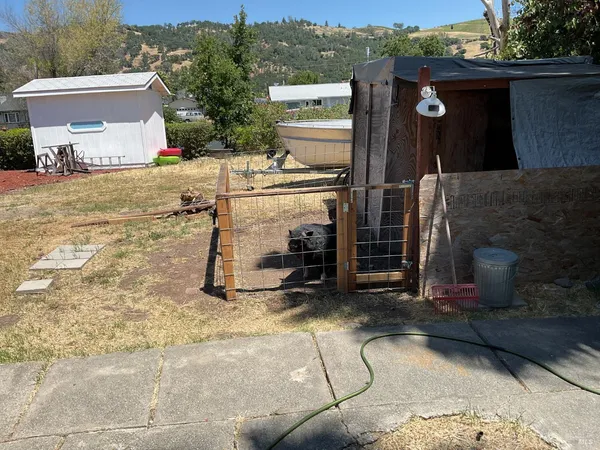 a living room with furniture and a roof