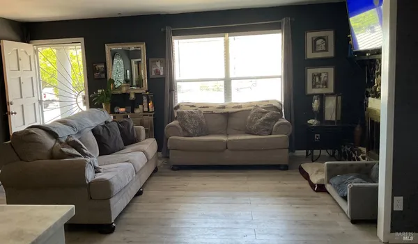 a living room with furniture and a window