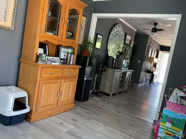 a view of a hallway with paintings on the wall