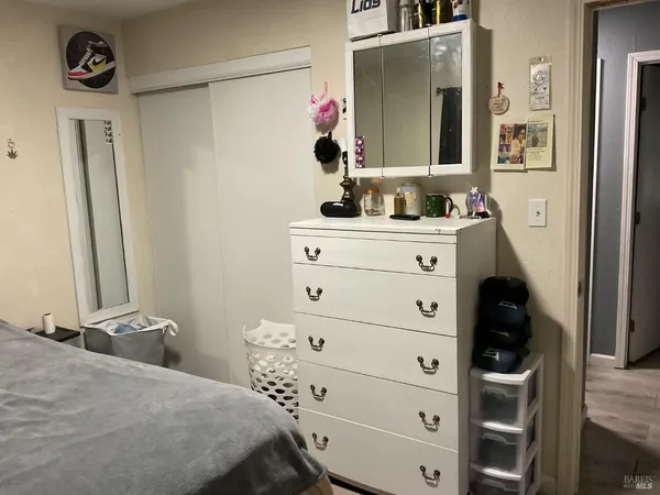 a bedroom with a bed and a closet