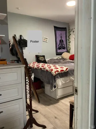 a bedroom with a bed and cabinets