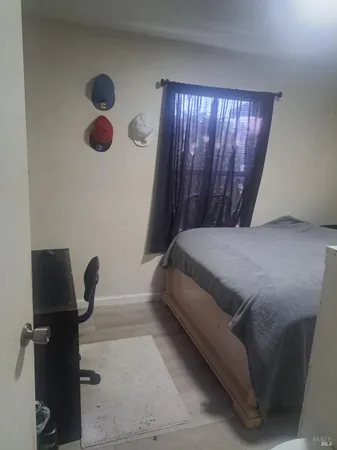 a white toilet sitting next to a shower