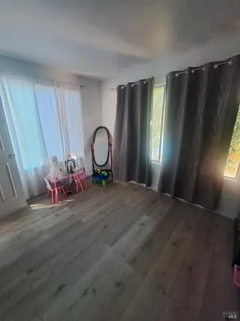 a bedroom with a dresser and a dresser