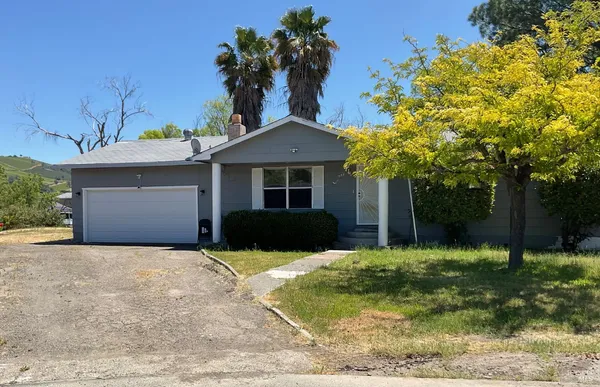 a view of a house with a street