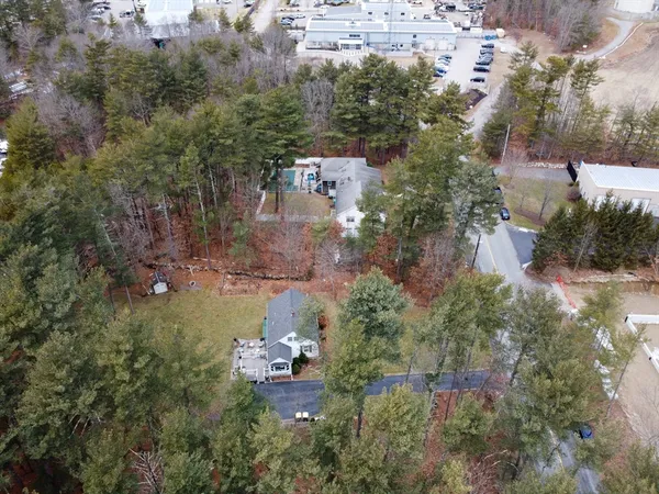 an aerial view of a house with outdoor space