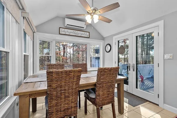 a view of a dining room with furniture window and outside view