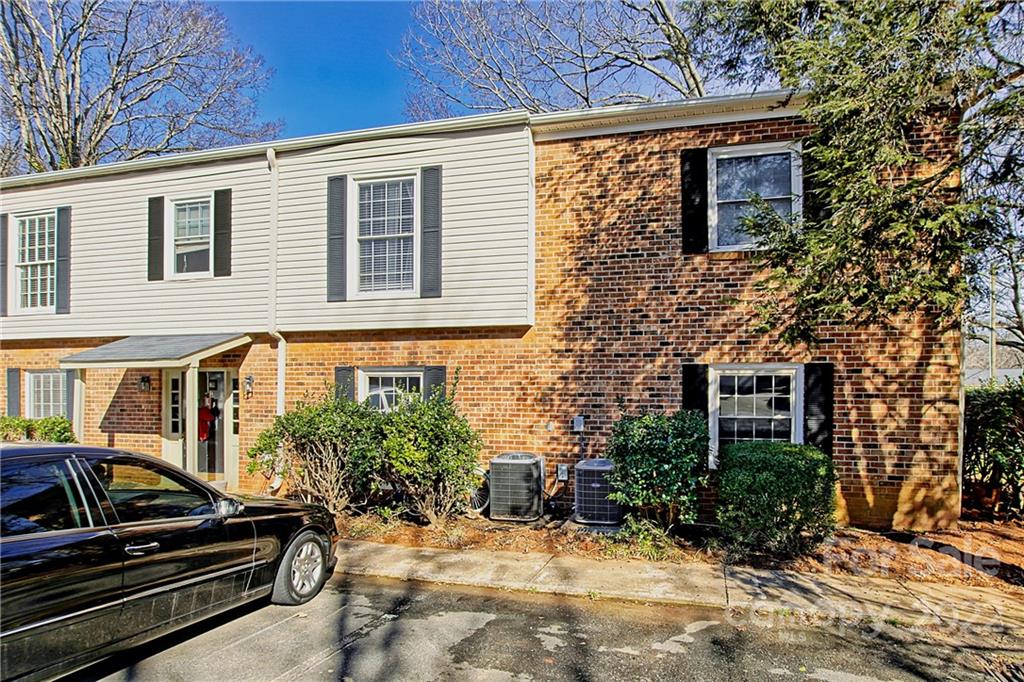 5925 Quail Hollow Road, Unit F Charlotte, NC 28210 - Photo 1 of 14 a view of a house with a patio
