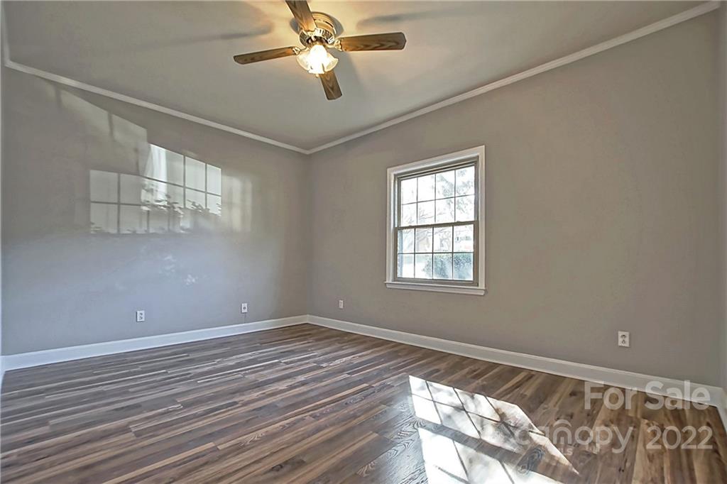 5925 Quail Hollow Road, Unit F Charlotte, NC 28210 - Photo 11 of 14 a view of a room with wooden floor and windows