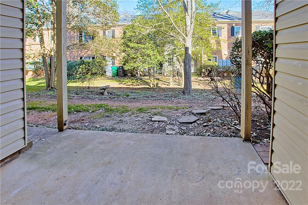 5925 Quail Hollow Road, Unit F Charlotte, NC 28210 - Photo 14 of 14 a view of a yard with plants and trees