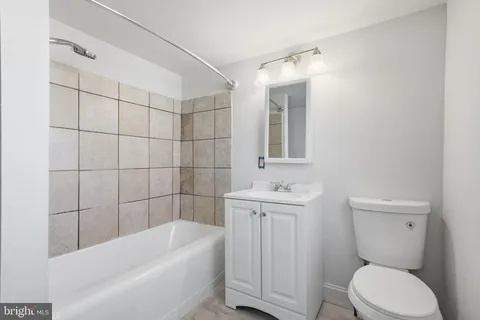 a bathroom with a bathtub and shower
