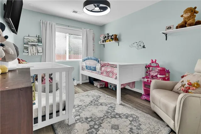 a bedroom with furniture and a couch