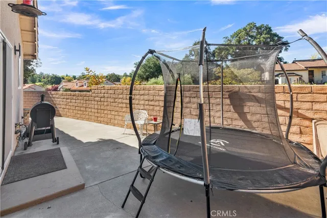 a view of balcony with two chairs and a potted plant