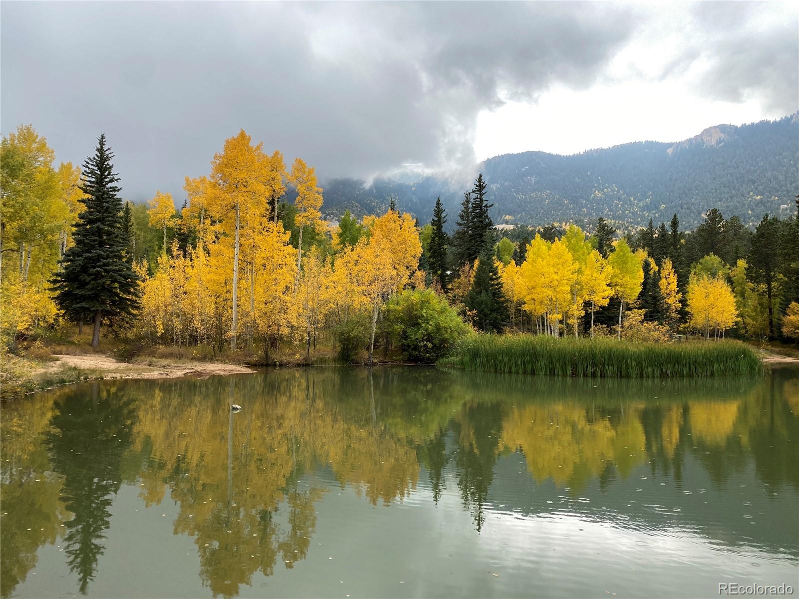 116 Happy Valley Road Manitou Springs, CO 80829 - Photo 21 of 25 a view of a lake with houses