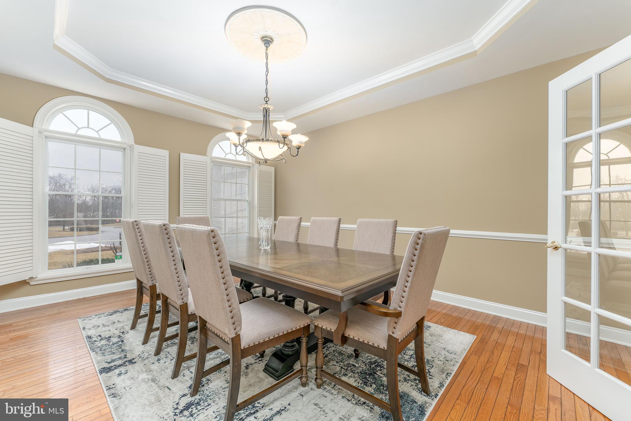 300 Bell Court Exton, PA 19341 - Photo 15 of 79 a dining room with furniture a chandelier and wooden floor