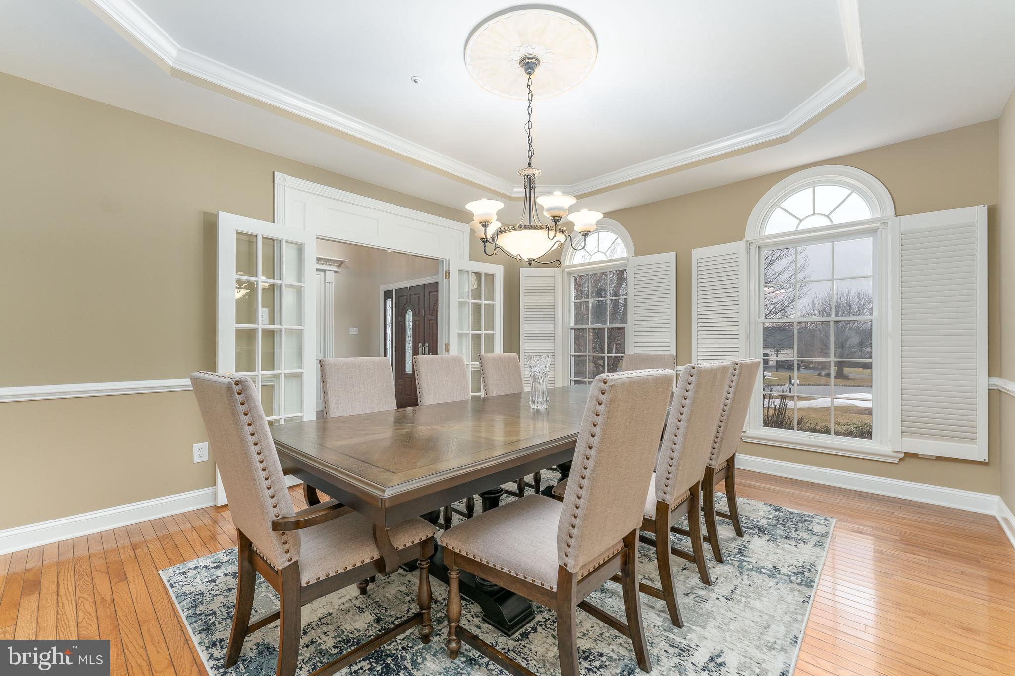 300 Bell Court Exton, PA 19341 - Photo 16 of 79 a dining room with furniture a chandelier and wooden floor