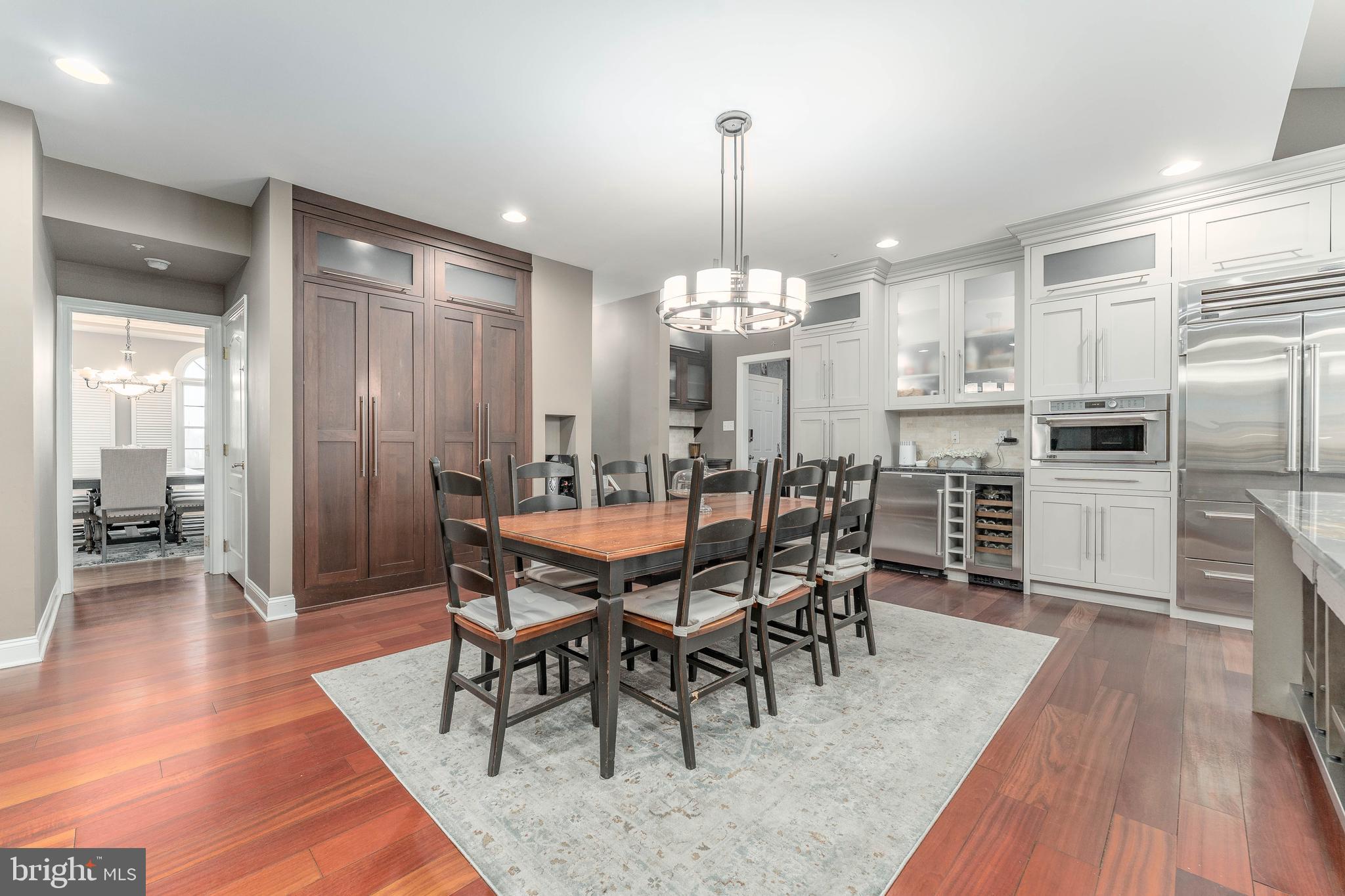 300 Bell Court Exton, PA 19341 - Photo 27 of 79 a view of a dining room and livingroom with furniture wooden floor a chandelier
