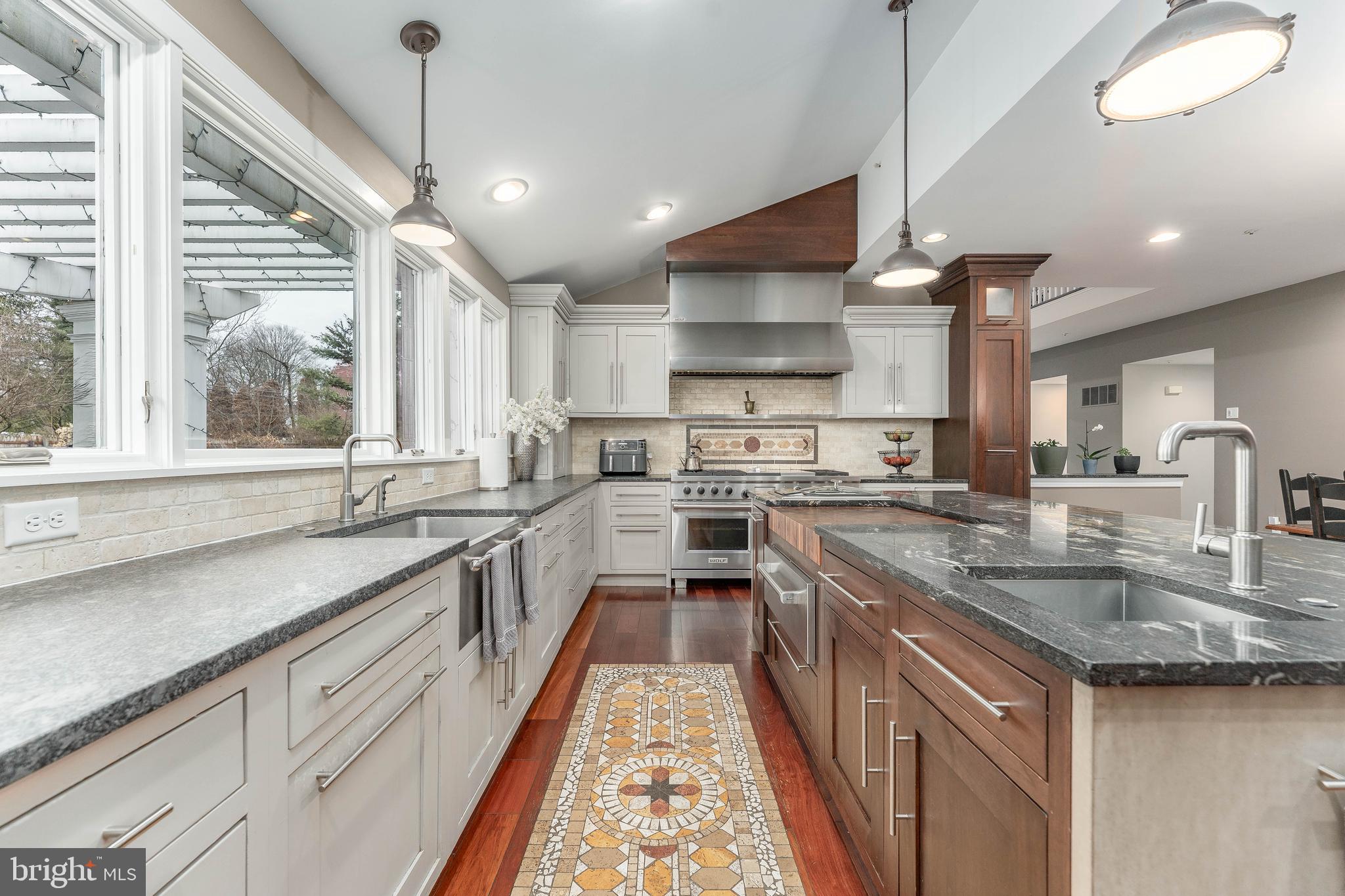 300 Bell Court Exton, PA 19341 - Photo 31 of 79 a kitchen with stainless steel appliances granite countertop a sink a stove and a wooden floors
