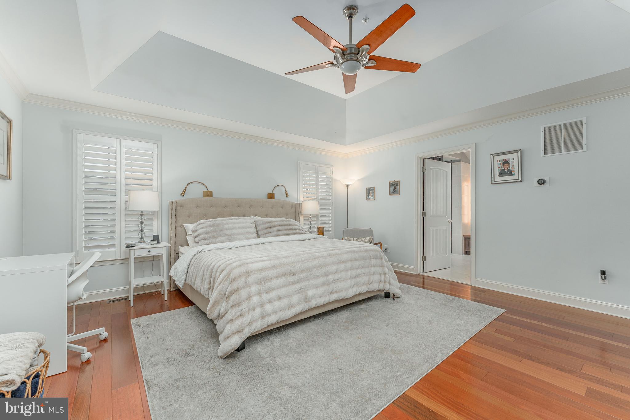 300 Bell Court Exton, PA 19341 - Photo 39 of 79 a spacious bedroom with a bed and a chandelier