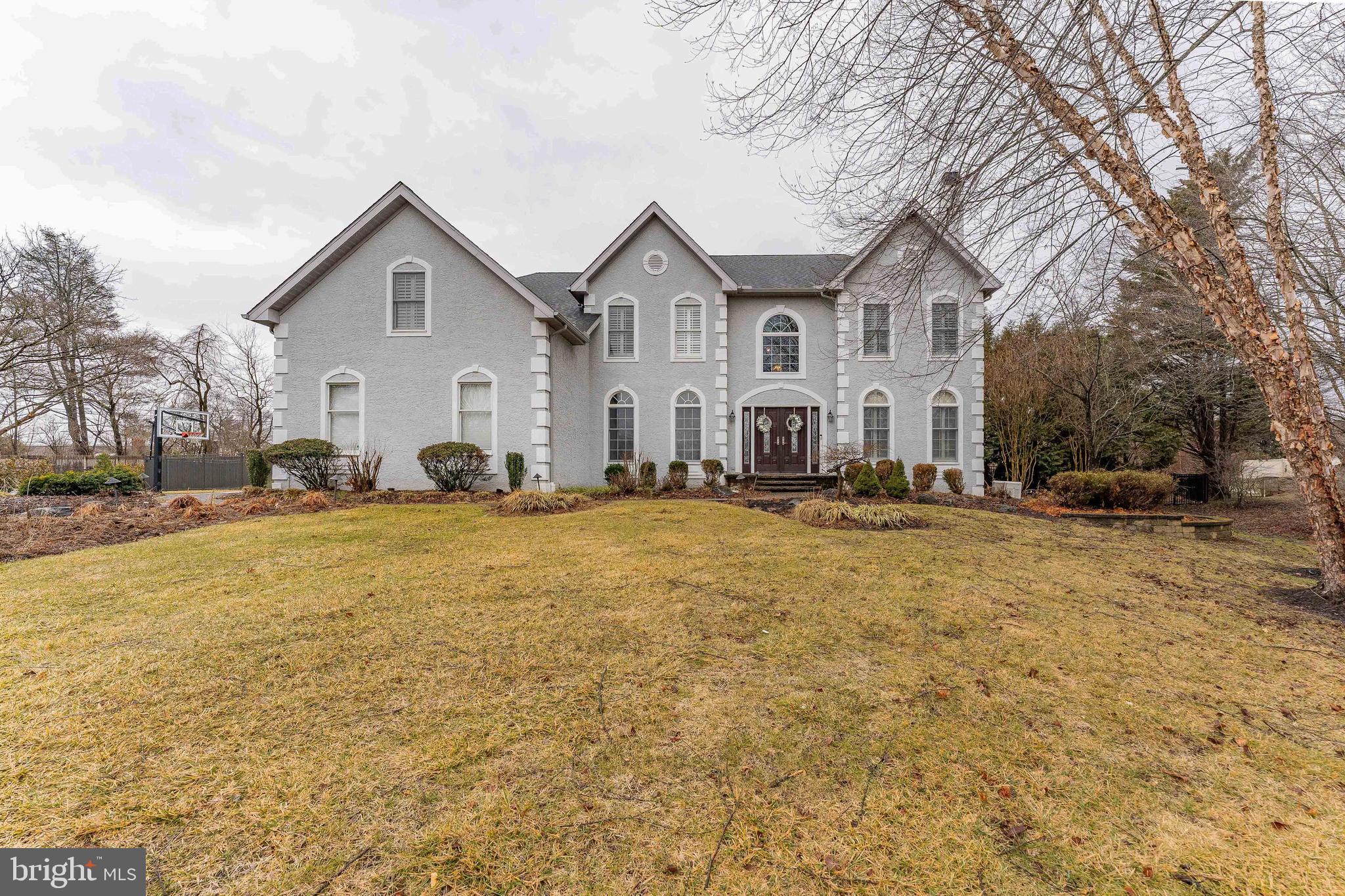 300 Bell Court Exton, PA 19341 - Photo 4 of 79 a view of a white house with a yard covered with snow