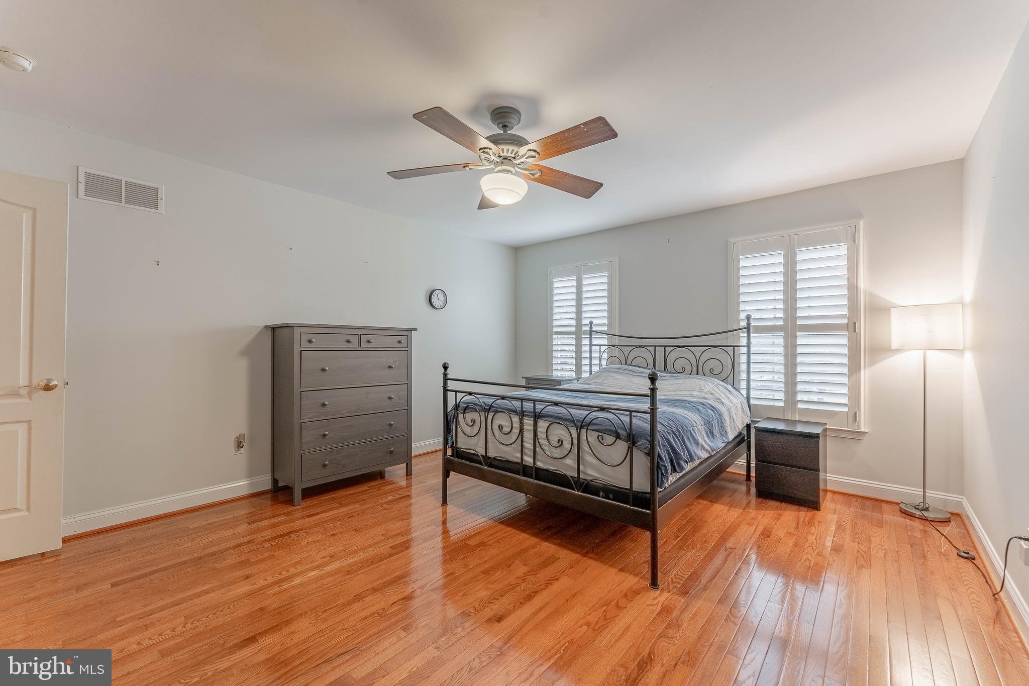 300 Bell Court Exton, PA 19341 - Photo 47 of 79 a bedroom with a bed and wooden floor