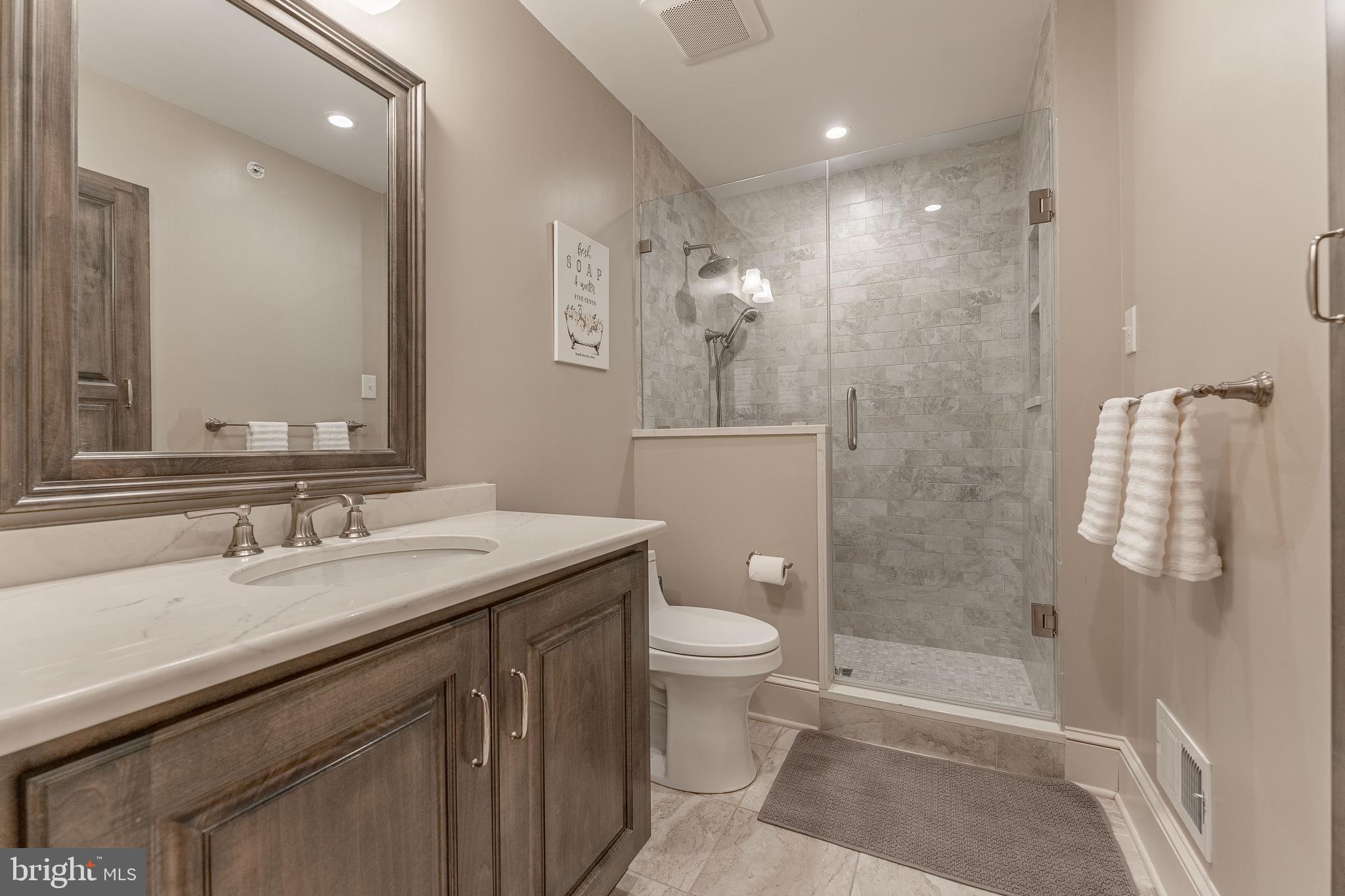 300 Bell Court Exton, PA 19341 - Photo 52 of 79 a bathroom with a granite countertop sink toilet and shower