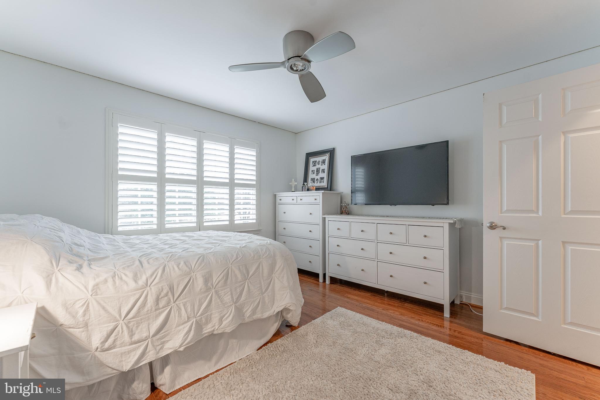 300 Bell Court Exton, PA 19341 - Photo 53 of 79 a bed room with a flat screen tv on dresser and a window