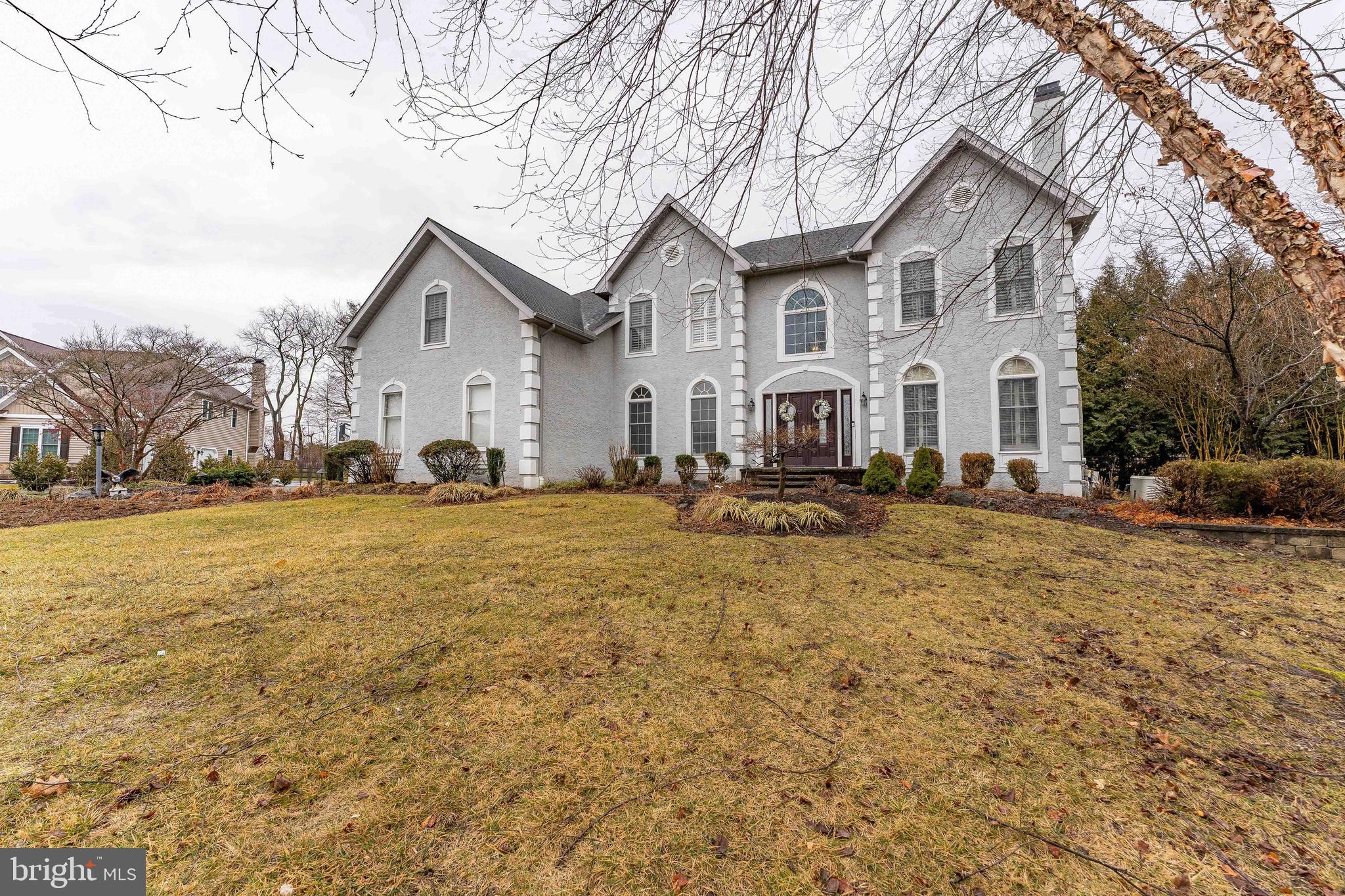 300 Bell Court Exton, PA 19341 - Photo 6 of 79 a front view of a house with a yard covered with snow