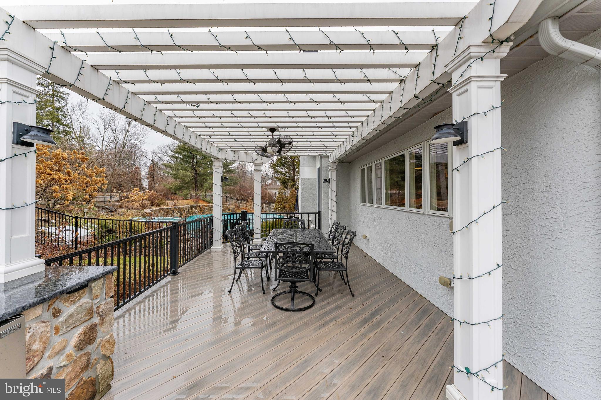 300 Bell Court Exton, PA 19341 - Photo 67 of 79 a view of a patio with table and chairs with wooden floor and fence